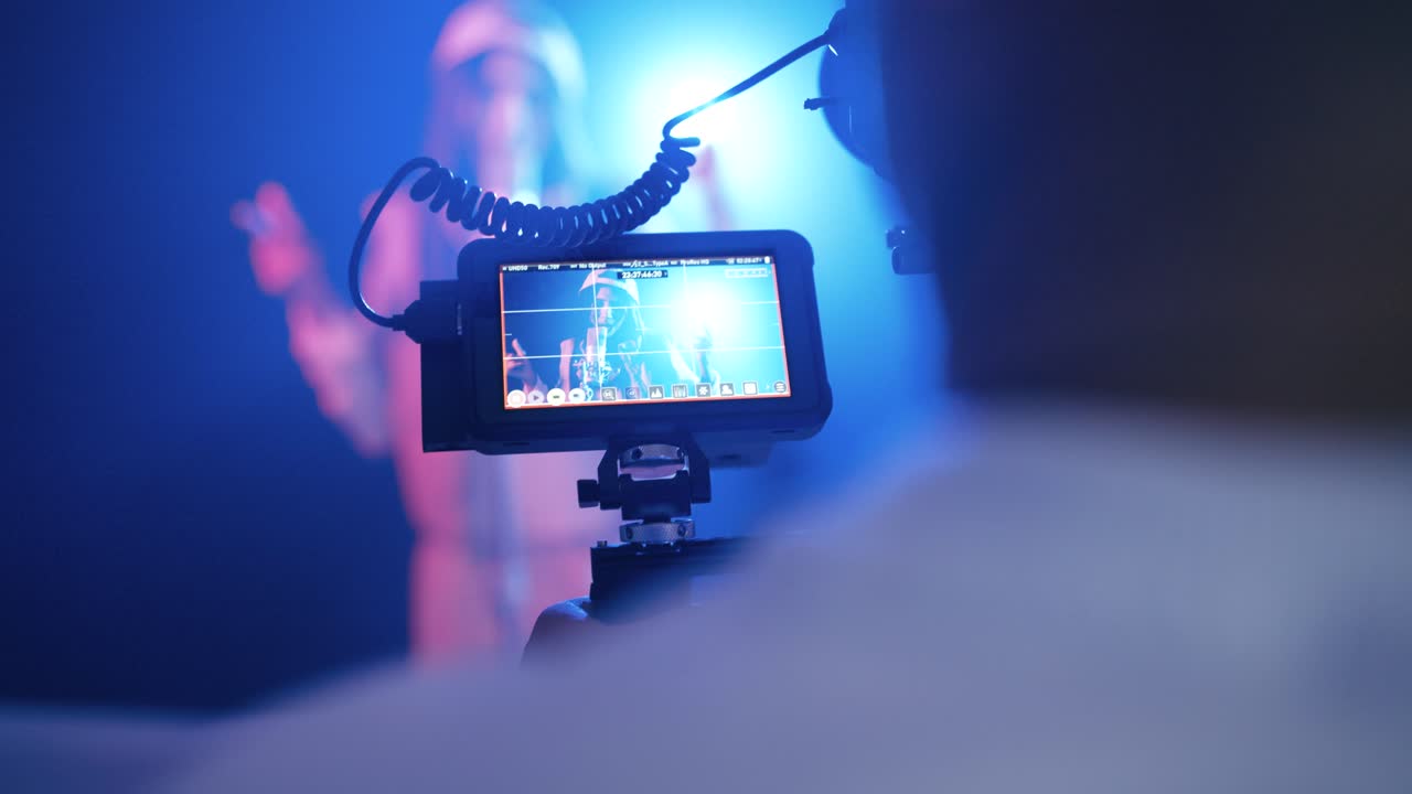 Cameraman filming reggaeton music video on set