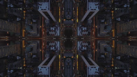 Top-down-shot-of-streets-and-building-blocks-in-urban-borough.-High-angle-view-of-metropolis-at-night.-Abstract-computer-effect-digital-composed-footage