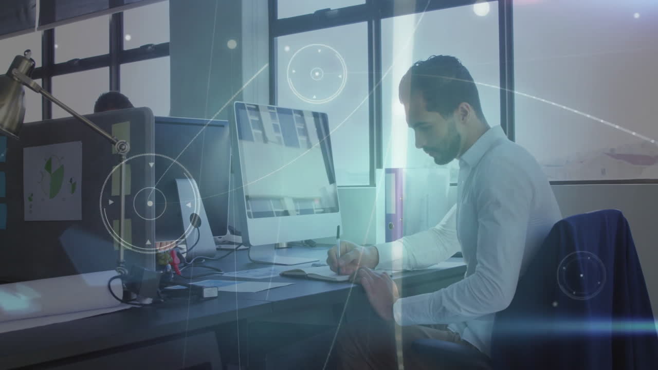 Man working at desk with computer, surrounded by digital data animation