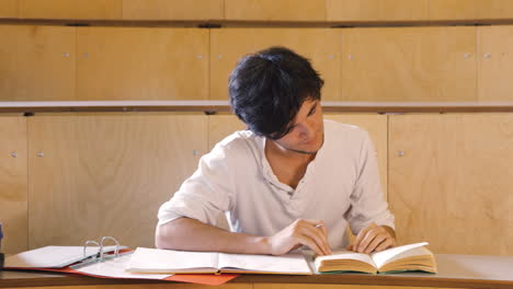 handsome student reading book