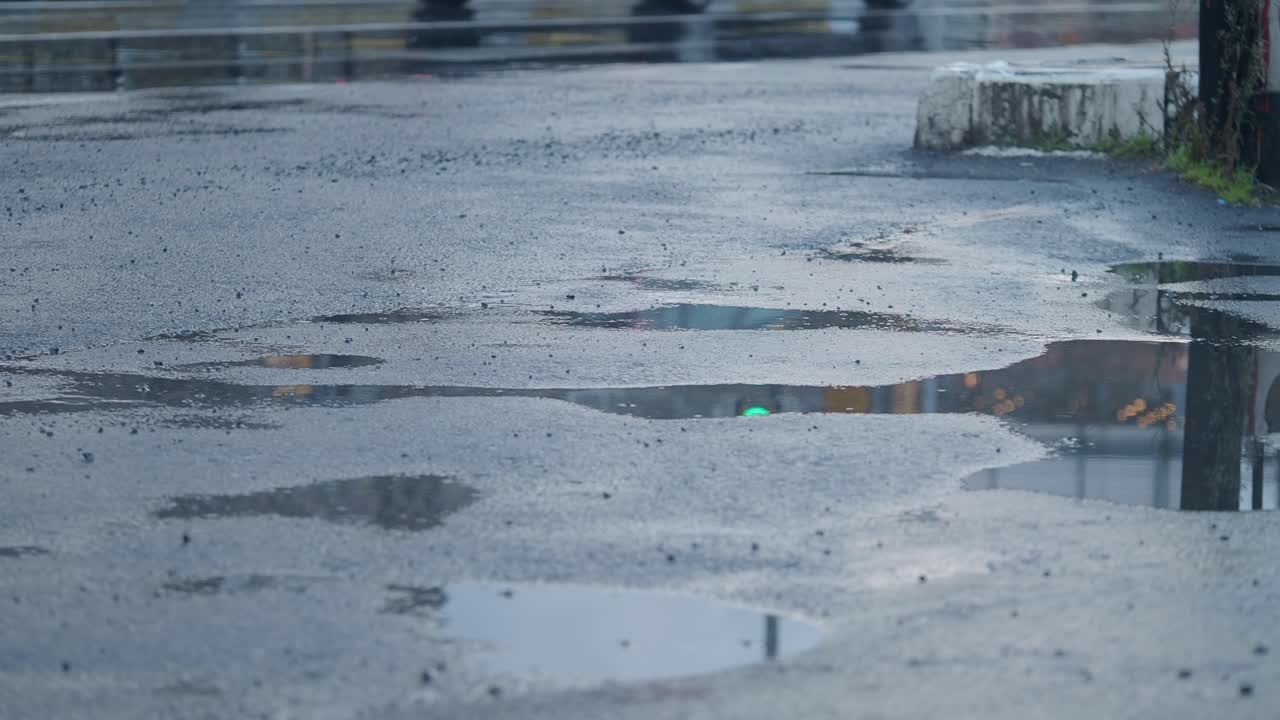 Rainy City Street with Puddles