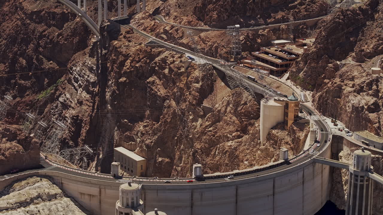 Hoover Dam Nevada Aerial v20 zoomed flyover capturing a concrete dam in the Black Canyon of Colorado River, with a freeway bridge connecting the borders - Shot with Mavic 3 Pro Cine - Apr 16th 2024