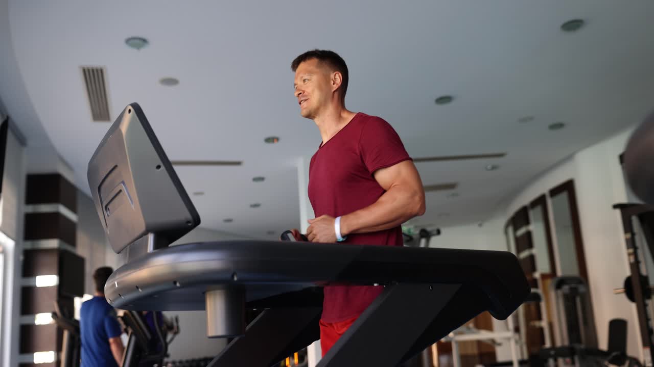 Man exercising on treadmill in the gym