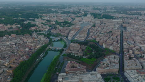 Panorama-of-borough-with-historic-landmarks-and-tourist-sights.-Bridges-over-Tiber-river-near-Castel-SantAngelo-and-St.-Peters-Square-with-large-basilica.-Rome,-Italy