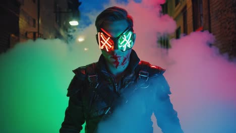 person with neon light mask in smoky urban alley