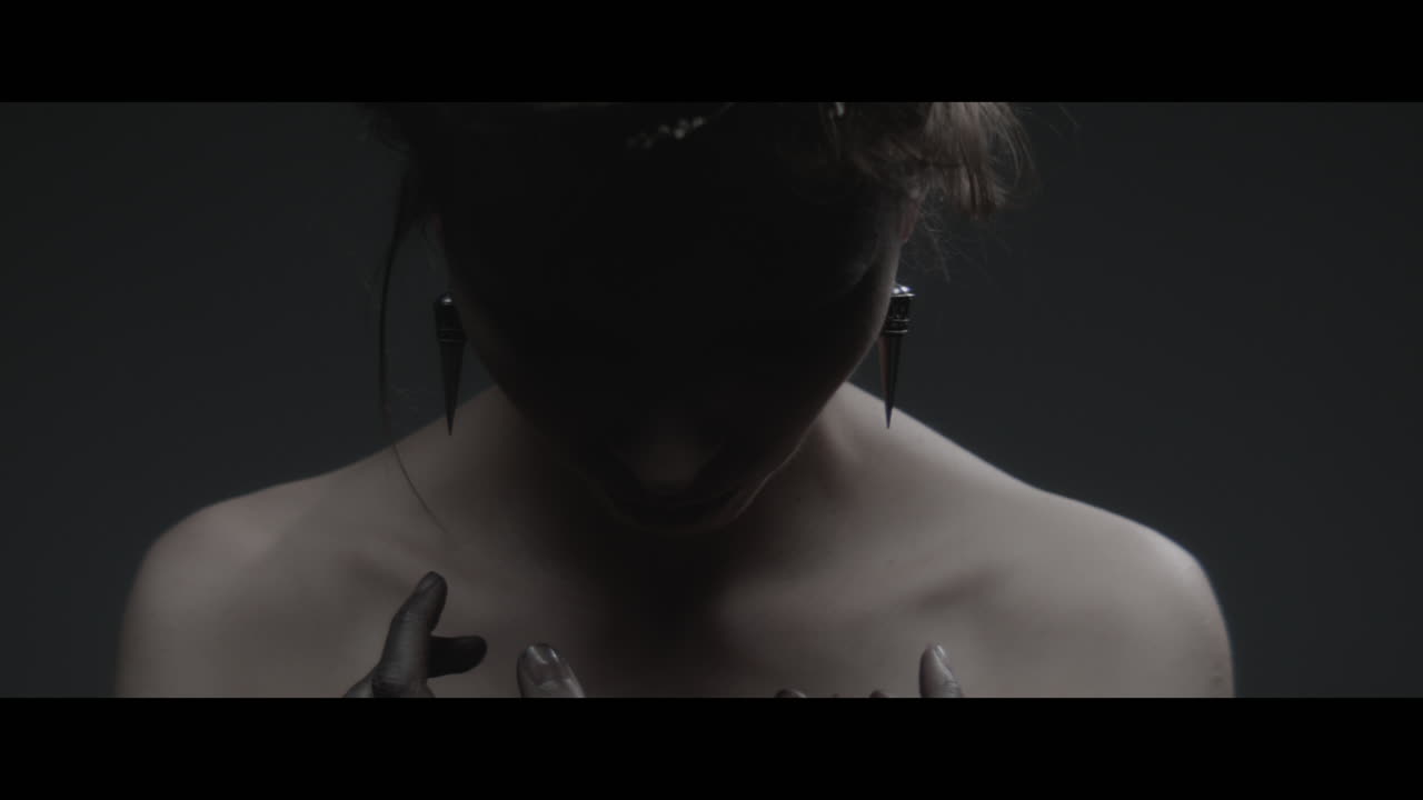 A woman dressed as mother nature rise her head