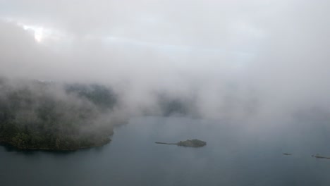 aerial revealing shot of a little island in the tziscao lake, chiapas