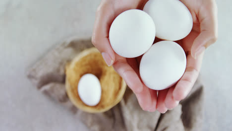 woman holding white eggs 4k