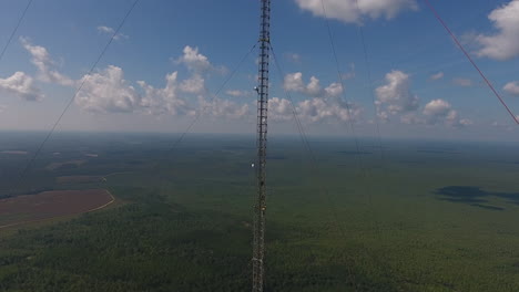 an aerial shot moving towards a communication tower