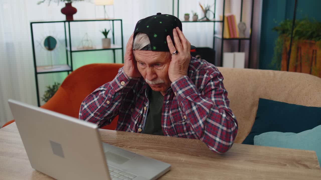 Amazed senior grandfather use laptop computer receive good news message shocked by sudden win wow