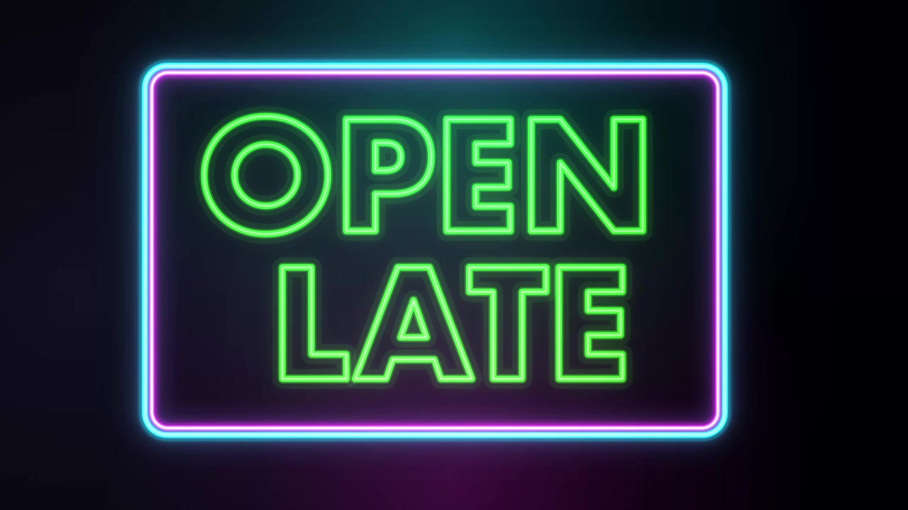 Vibrant neon sign flickering on black background with green text and blue glowing border.