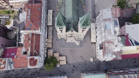 Sacred-heart-cathedral-aerial-Birdseye-view-into-reveal-of-centre-of-Sarajevo-old-town-district-in-Bosnia-and-Herzegovina