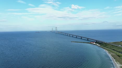 elegant suspension bridge storebelt connecting islands in denmark aerial forward