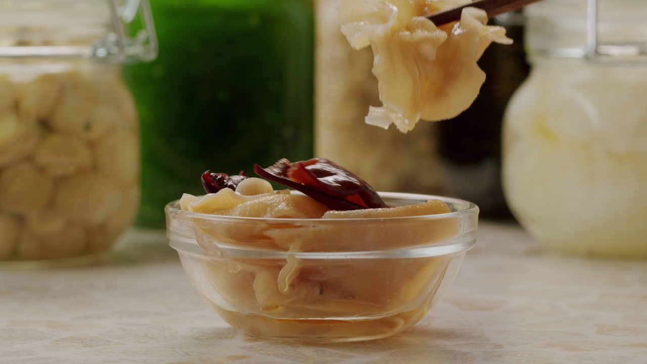 Preservation of vegetables in banks. Fermentation products. Harvesting mushrooms for the winter. Copy space. High quality 4k footage