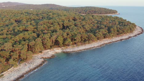 aerial circling shot around the coast of losinj island, croatia during the day