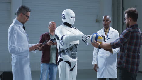 scientists observing a robot handling a ball in a warehouse