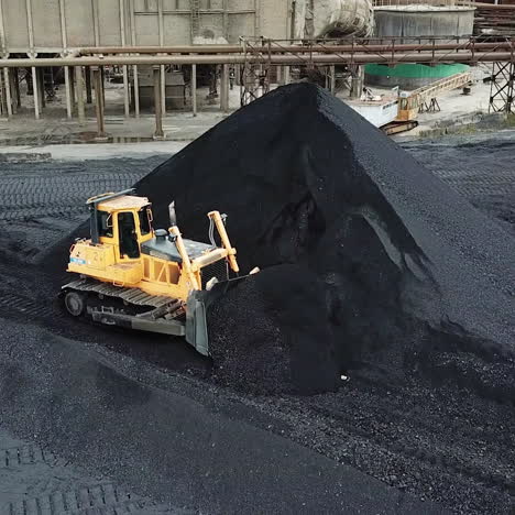 bulldozer sorts coal. extractive industry, anthracite. coal industry.