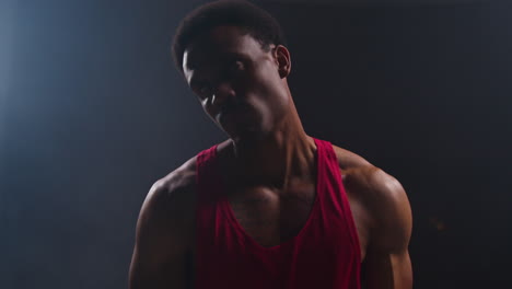 Portrait-Of-Boxer-Wearing-Gloves-Entering-Ring-Before-Start-Of-Boxing-Match-And-Warming-Up-1