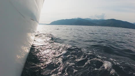 sailing yacht on the ocean with mountain view