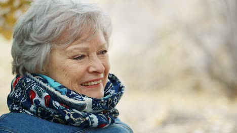 smiling senior woman outdoors
