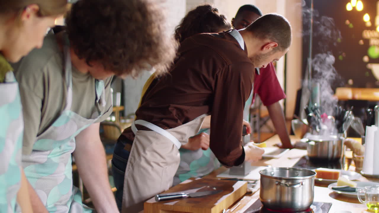 Chef Showing How to Grate Cheese at Cooking Master Class