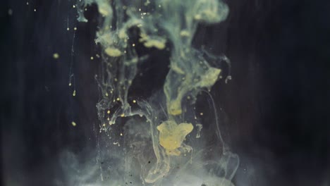 colored paint floating in darkish water tank. stable shot with the sony a7iii