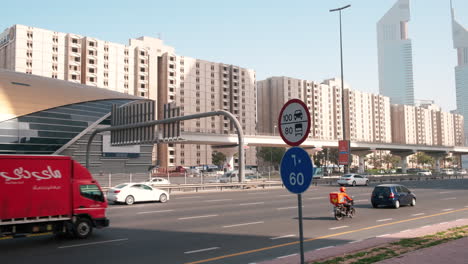 traffic on sheikh zayed road, metro train, dubai, handheld camera