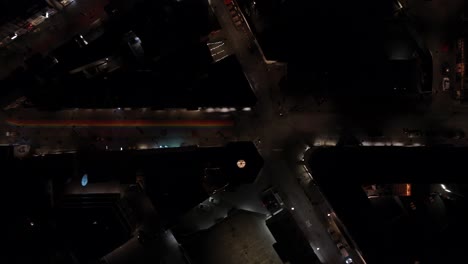 downtown reykjavik with famous rainbow street at night, drone shot