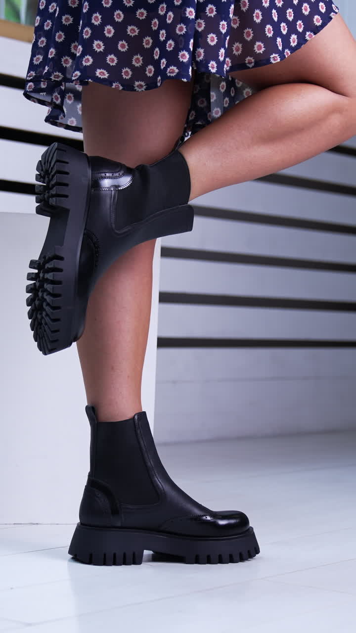 Slow motion with elegant legs and footwear. Gorgeous lady legs with fashionable shoes. Vertical video