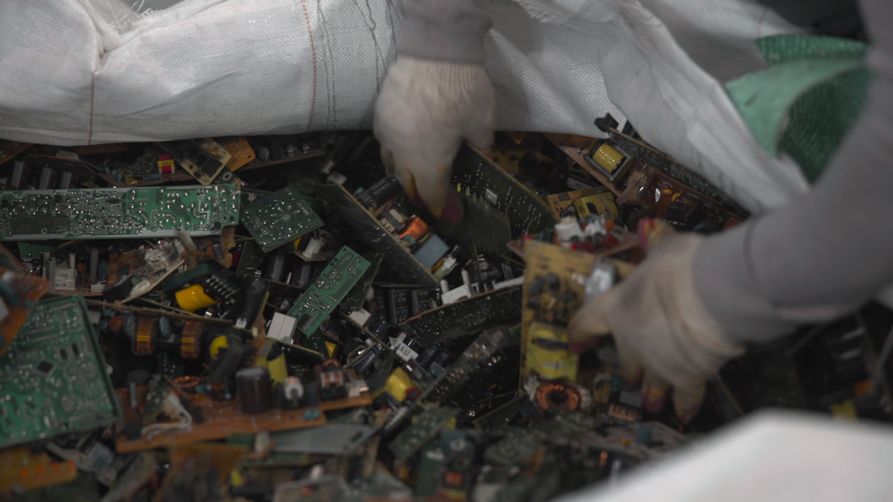 Gloved Hands Sorting Circuit Boards Worker Manually Selects Components From Bulk Bag, Careful Inspection . Media