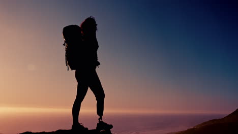 disabled woman hiking at sunset