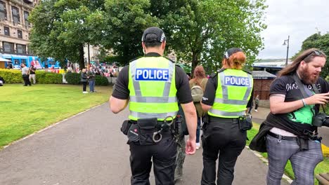 police officers walking through festival crowd