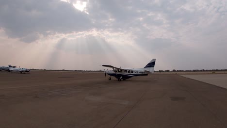 light aircraft starts engine to take off at an airport in south africa