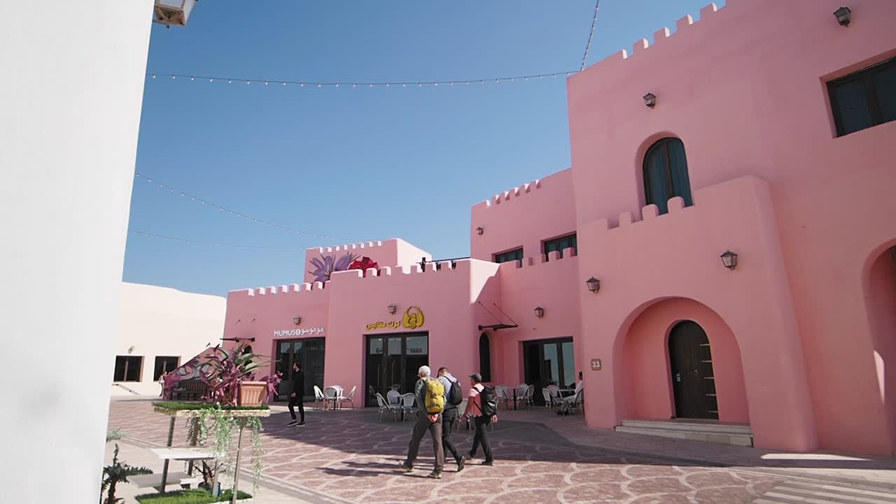 Pink Building Cafe with Outdoor Seating