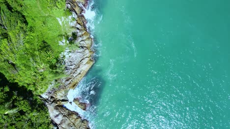 Aerial-Top-View-of-Ocean-Waves-Reaching-Beach-Shore