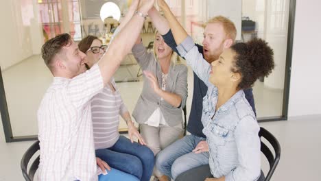 colleagues high fiving after discussion