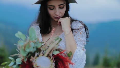 elegant stylish bride. portrait of bride posing against mountain