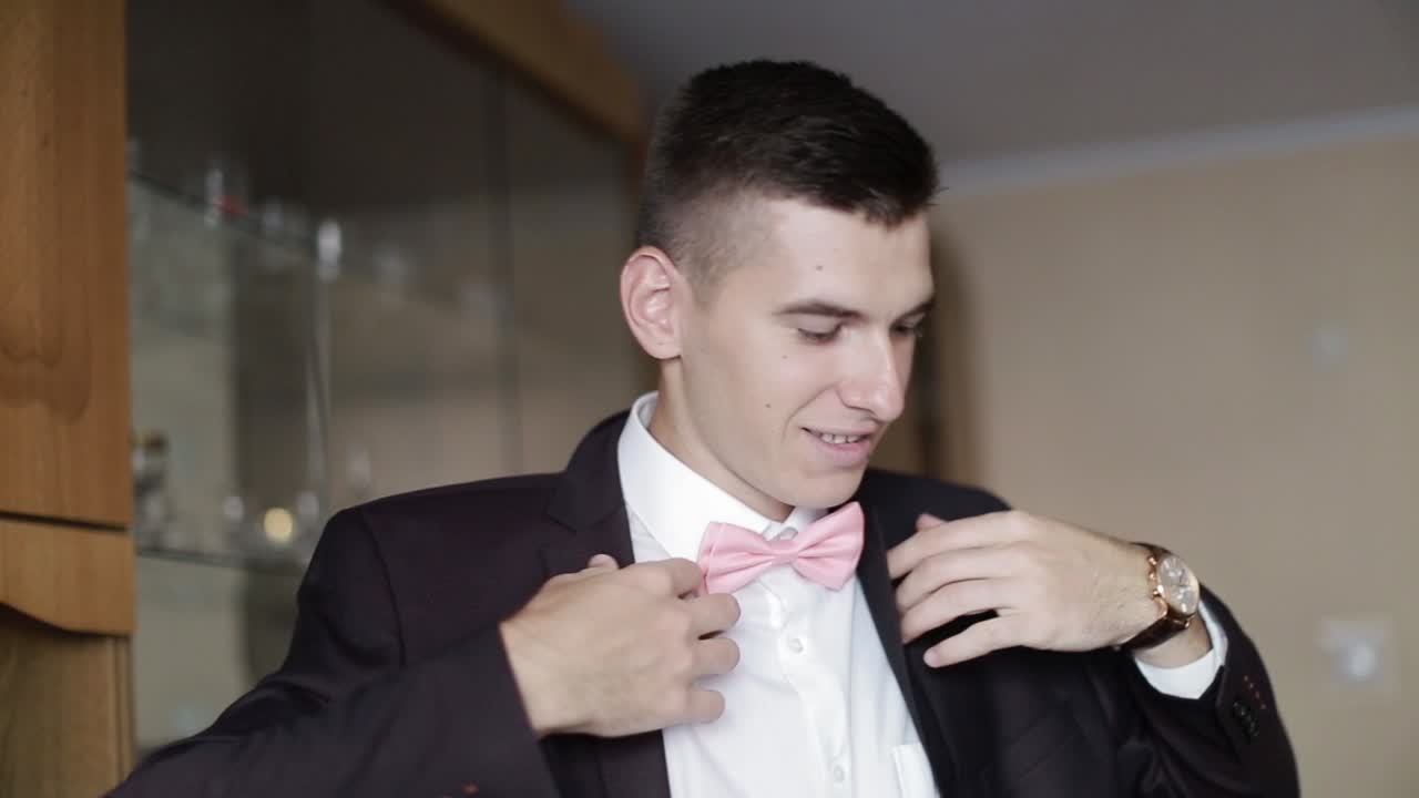 Elegant Groom In Wedding Jacket. Handsome groom in suit. Wedding morning