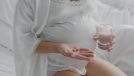 pregnant woman taking medicine