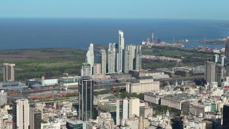 aerial view of skyscrapers on coast of rio de la plata and nature reserve in puerto madero. buenos aires.