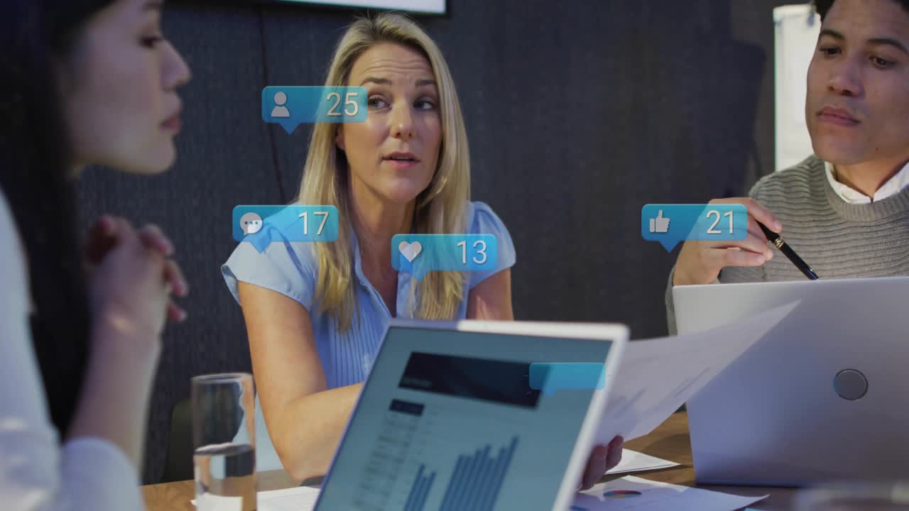 Presenter reviewing charts in business meeting, causing AR icons climbing illustrating engagement