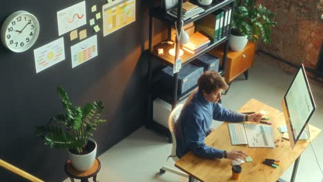 businesswoman working on computer at desk in the office