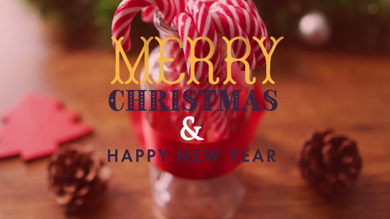 Merry Christmas and Happy New Year text animation over candy canes in jar