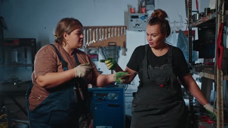 women mechanics working together in a garage