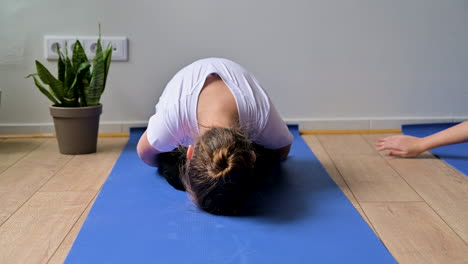 little girl on yoga mat