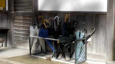 Outdoor-Umbrella-Drying-Rack-Beside-Wooden-Building-In-Koyasan,-Japan