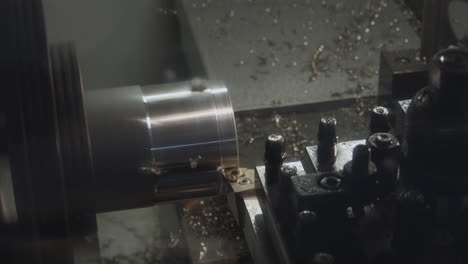 A-CNC-machine-working-on-a-metal-cylinder