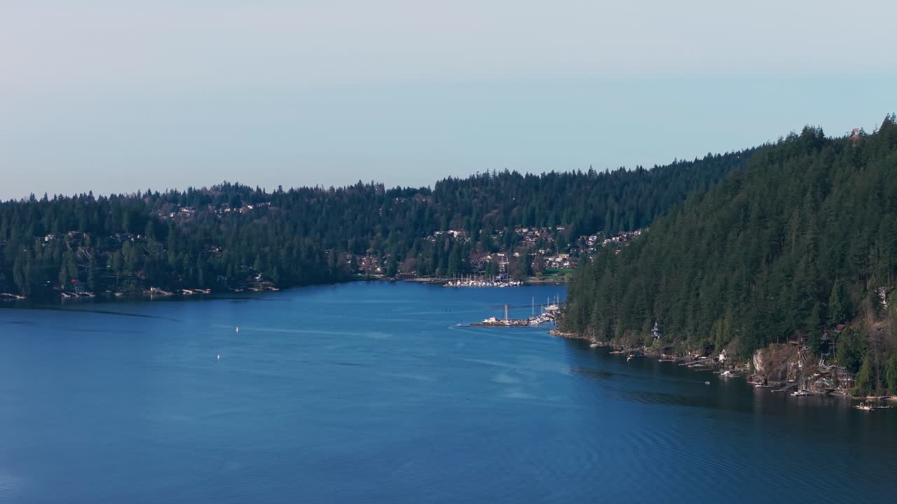 an scenic aerial drone shot of luxury homes along the Indian River Wharf surrounded by green lush trees