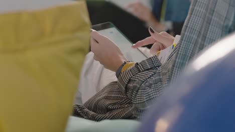 close-up-hands-business-woman-using-digital-tablet-computer-browsing-corporate-project-information-viewing-financial-growth-development-data-on-screen-brainstorming-strategy-in-office