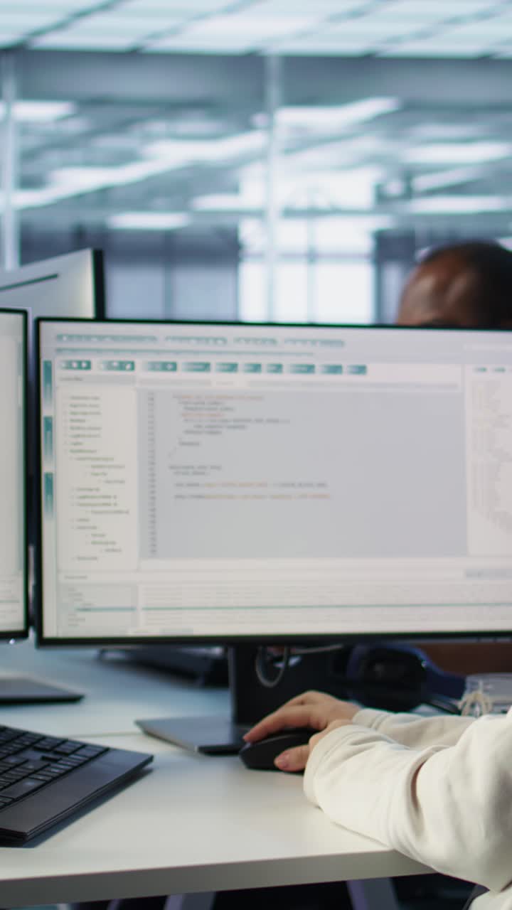 Woman Coding on Computer in Modern Office Environment
